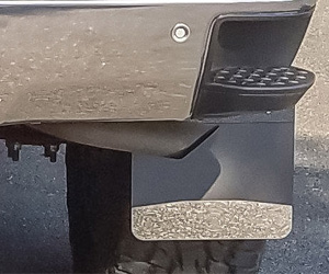 A truck's textured rear mud flap.